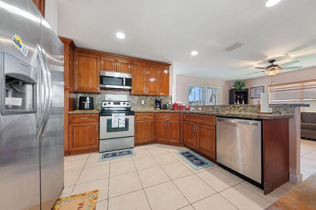 Photo of 5217 Rising Comet Lane, Greenacres, FL 33463 (MLS # B26017210)