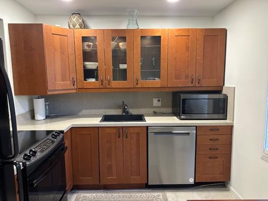 Spacious renovated first floor corner unit with water/canal view.  2 bed 2 bath with private screened patio area. Privacy wall! Few steps to your tropical pool and clubhouse area. One of the best locations in complex!. Renovated kitchen with quartz counter tops and custom cabinets with lighting. Stainless steel appliances. Equipped with Hurricane Impact Glass!! Beautiful wood flooring and renovated bathrooms. No carpet! 10 min to beach. Water, Sewer and Trash included. Can be offered partially furnished or unfurnished. All Ages Ok. No Pets No trucks as per association. Walking distance to shops, grocery, dining and more. Easy access to 95 and approx. 5 min drive to Pompano Beach and fishing pier. Community pool, clubhouse, jacuzzi and tennis. min credit score 650 as per assn