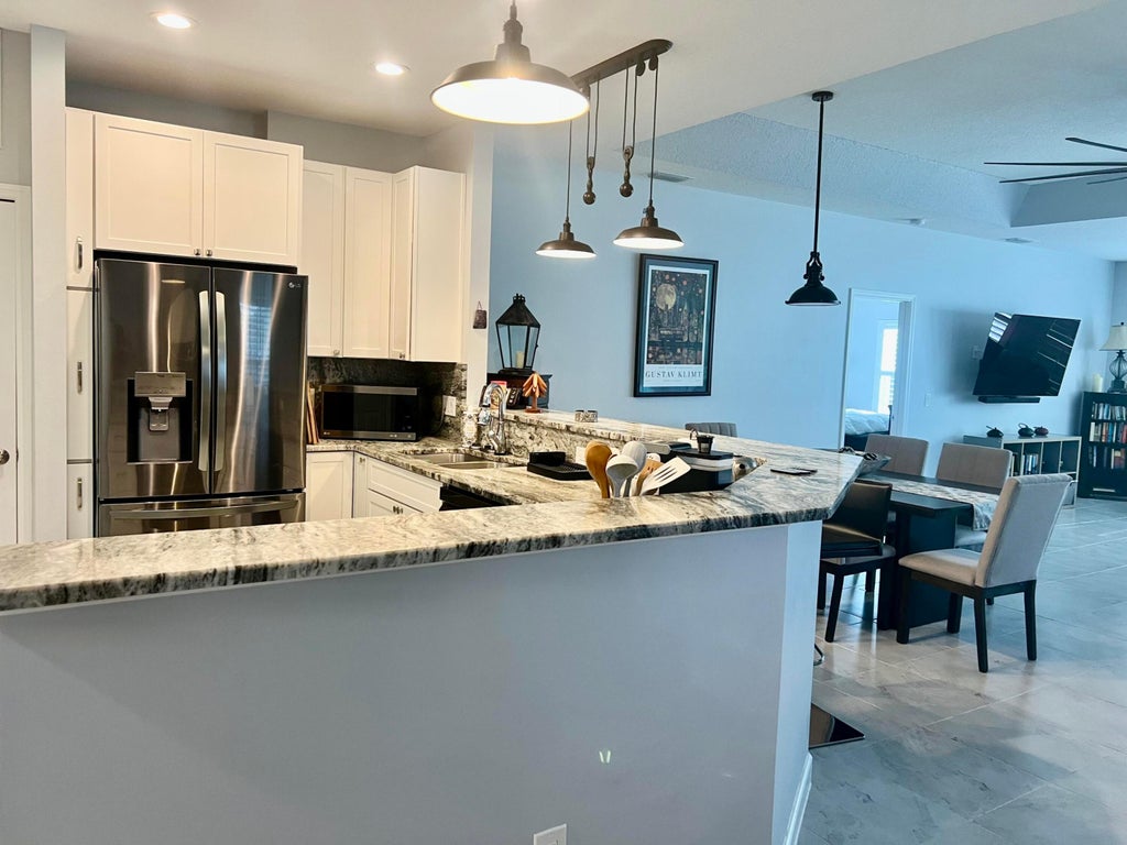 Photo of 4042 GATOR TRACE Road, Fort Pierce, FL 34982 (MLS # B26066897)