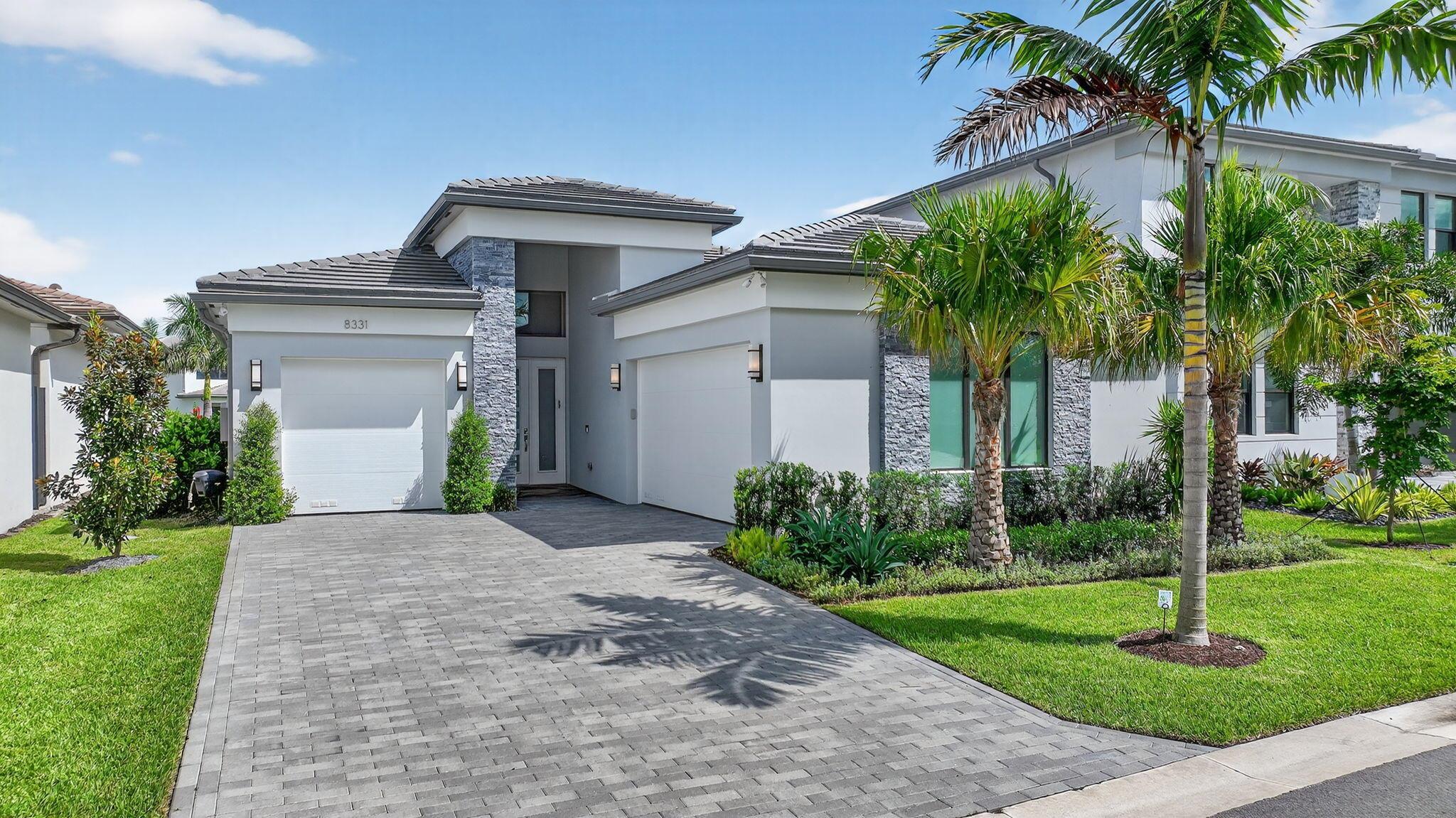 Beautifully decorated one-story, 3-bedroom + office home with quiet lake views in Lotus Palm! Barely lived-in Bermuda model complete with designer window treatments, electric shades throughout, and full-house generator. The interior is light, bright, and open. Eat-in kitchen features an extended waterfall island, built-in coffee bar, and stainless steel appliances, including a gas cooktop and double ovens. Master suite has 2 large custom walk-in closets, and a master bath with 2 sinks, large shower, custom stand-alone tub, and touchless commode. All guest bedrooms are ensuite with built-out closets. Outside, the backyard features a pool with spa, entertainment area, and stunning lake views. Furniture is negotiable.