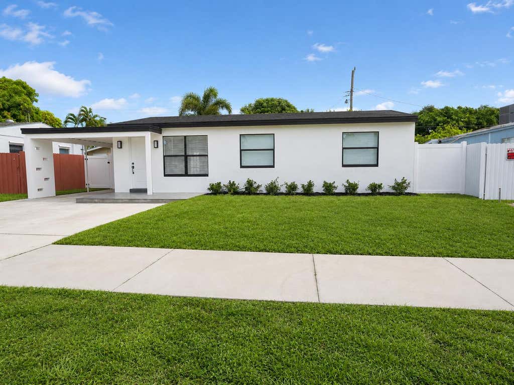 Photo of 2013 LONGWOOD Road, West Palm Beach, FL 33409 (MLS # B26061994)