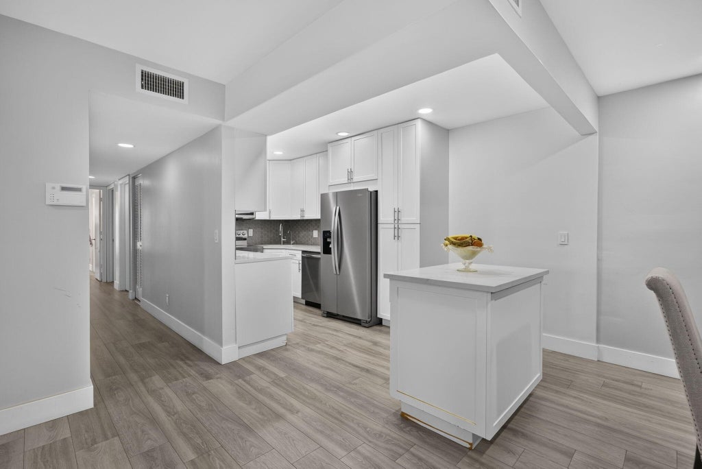 Photo of 820 Sky Pine Way #H2, Greenacres, FL 33415 (MLS # B26063392)