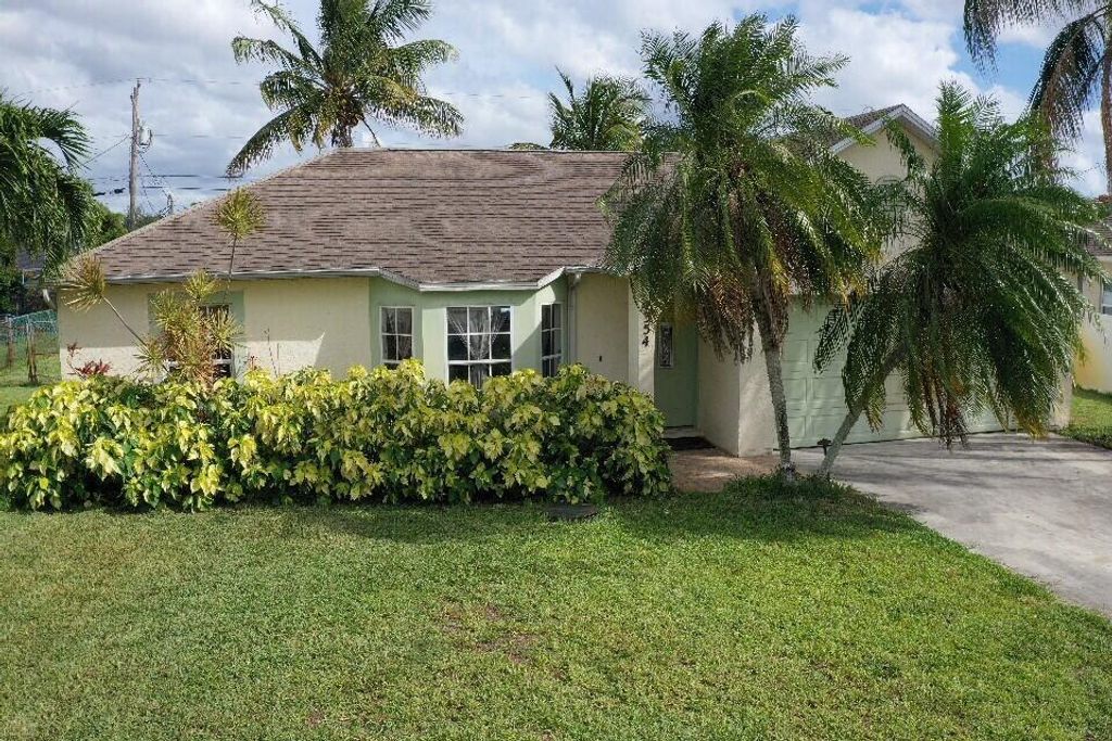 Photo of 1354 SW Axtell Avenue, Port Saint Lucie, FL 34953 (MLS # R10998189)