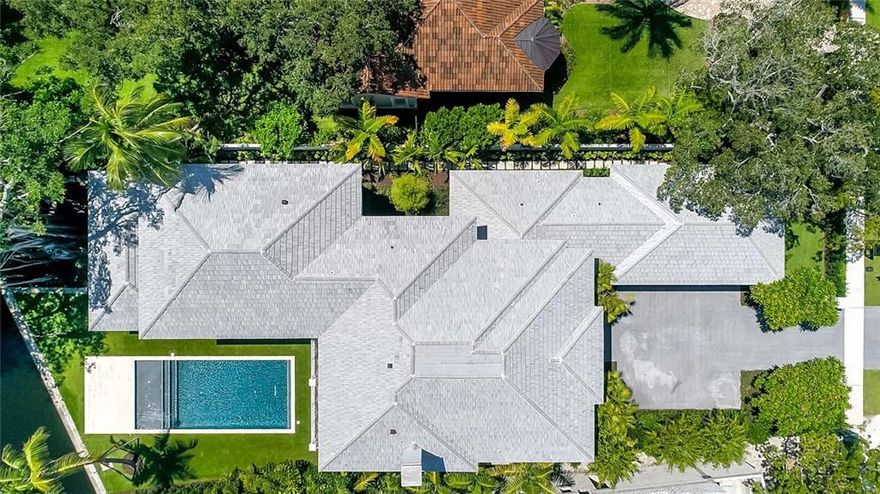 Class and elegance are the 2 words that describe this new home. Just completed and now ready for the new owner. This home has 4 bedrooms upstairs and a VIP guest room on the main floor. Windows for days and an open floor plan. Built for the entertainer who loves to have company. Master suit overlooks Tarpon River, 100' on the water. 5 full bathrooms and a powder room and outside cabana bath. The contractor is Bomar Builders and Architect is Carlos Martin Architects. Lot is 17,000' Call for showing