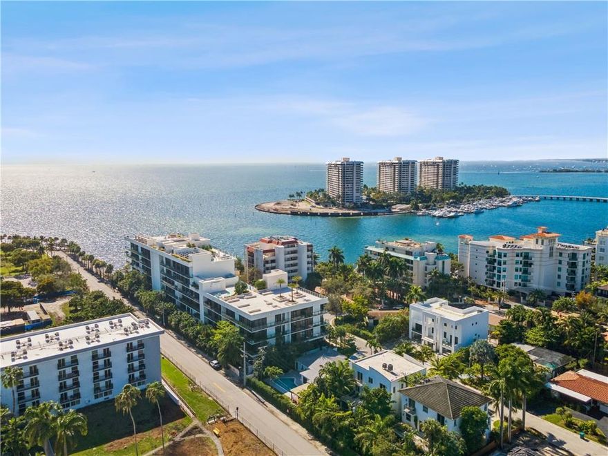 Ocean & Bay views from EVERY room! 4 bed (plus office; all en suite), 5.5 bath corner unit offers 3900+ SF of int/ext space. Custom designed/curated finishes are incld in this turn-key home w/11-ft ceilings, natural stone flooring, gourmet kitch by Poliform, Sub-Zero & Wolf appls; fixtures by Dornbracht & Duravit, Crestron controlled lighting/dual zoned HVAC, electronically controlled window treatments, storage closet & prkng for 2 cars. The Fairchild, a boutique waterfront bldg, designed by Max Strang has 26 residences. Bespoke amenities: Concierge, Valet, Spa w/Hammam, Steam Rm, Sauna, Massage Rm, Gym, Rooftop Pool Deck, Private Cabanas, Grill Area, Private Dock to launch paddle boards/kayaks & more. Relax & listen to the sound of the waves or tap into the vibe that is The Grove & Miami. Ocean and views of Biscayne Bay abound from every room in this 4 bedroom (plus office), 5.5 bath home offering over 3200 SF of interior and 678 SF of terrace space. This corner unit has E, S and W exposures and is a rare offering at The Fairchild as it lends itself to total privacy and lives like a SFH. All bedrooms and the office are en-suite. Beautifully and serenely appointed all finishes for this space were custom designed or curated by award winning Miami interior designer, Miriam Moore, and are being included in the sale of this home. Built in 2020 the 26-unit building sits directly on Biscayne Bay in the Glencoe enclave and offers a stunning tropical setting. Designed by acclaimed architect Max Strang whose refined interiors also include, 11-foot ceilings, natural stone flooring, gourmet kitchens by Poliform, custom backsplashes, LED under cabinet lighting, Sub-Zero and Wolf appliances; and fixtures by Dornbracht and Duravit. A dual zoned HVAC, Crestron lighting/AC controls, electronically controlled window treatments, a large storage unit, and parking for two cars complete the packing. The owner can expand parking to 4 cars by adding lifts. Electric car charging stations can be added if the owner desires as well.  Bespoke amenities include, Concierge services, Valet parking, Spa with Hammam, Steam Room, Sauna, Massage Room, Locker Rooms, Gym, Rooftop Pool Deck with Private Cabanas, Grilling area, Sunset Deck, Roof Deck Movie Theater, and Private Dock where one can launch their paddle boards or kayaks. This is truly a serene perch overlooking the water where one can relish in privacy, peace and quiet or tap into all that Miami and The Grove have to offer as they are both just moments away.