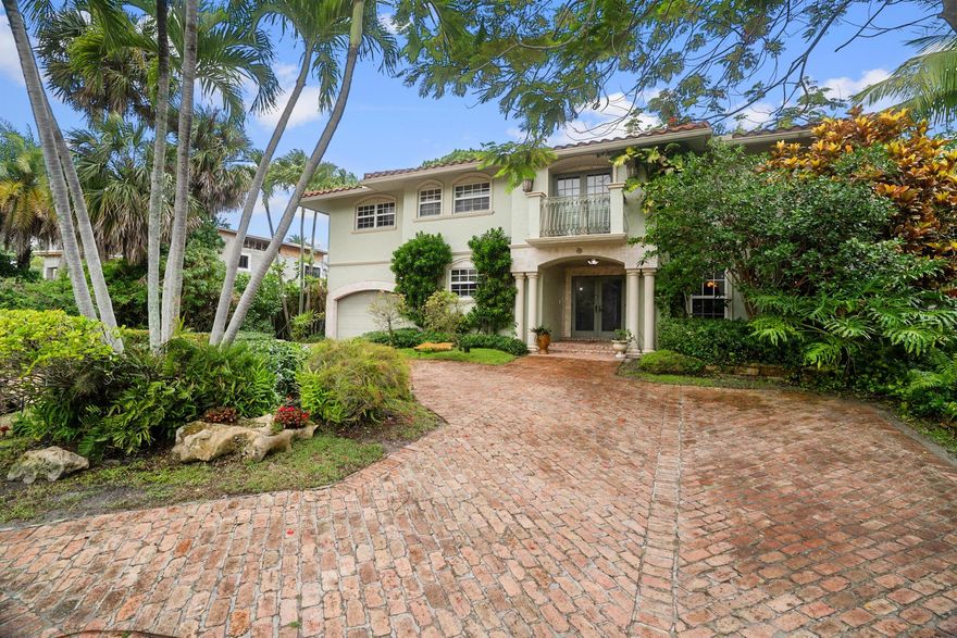 Exquisite Waterfront Estate with Private Dock in The Historic Old Floresta Area.Welcome to this one-of-a-kind custom-built estate nestled in Boca Raton's historic Old Floresta neighborhood. Located on the El Rio Canal with ocean access and a 30 ft. private dock, this home epitomizes the South Florida lifestyle. Sail into the Boca Inlet and the Atlantic Ocean or simply relax and watch the manatees swim by from your own backyard sanctuary. This magnificent residence seamlessly blends timeless elegance with contemporary luxury. Classic marble and rosewood flooring set the stage for a grand spiral staircase, a coral stone fireplace, and a gorgeous chef's kitchen designed for both everyday living and lavish entertaining. A custom-built office provides the perfect space for productivity and