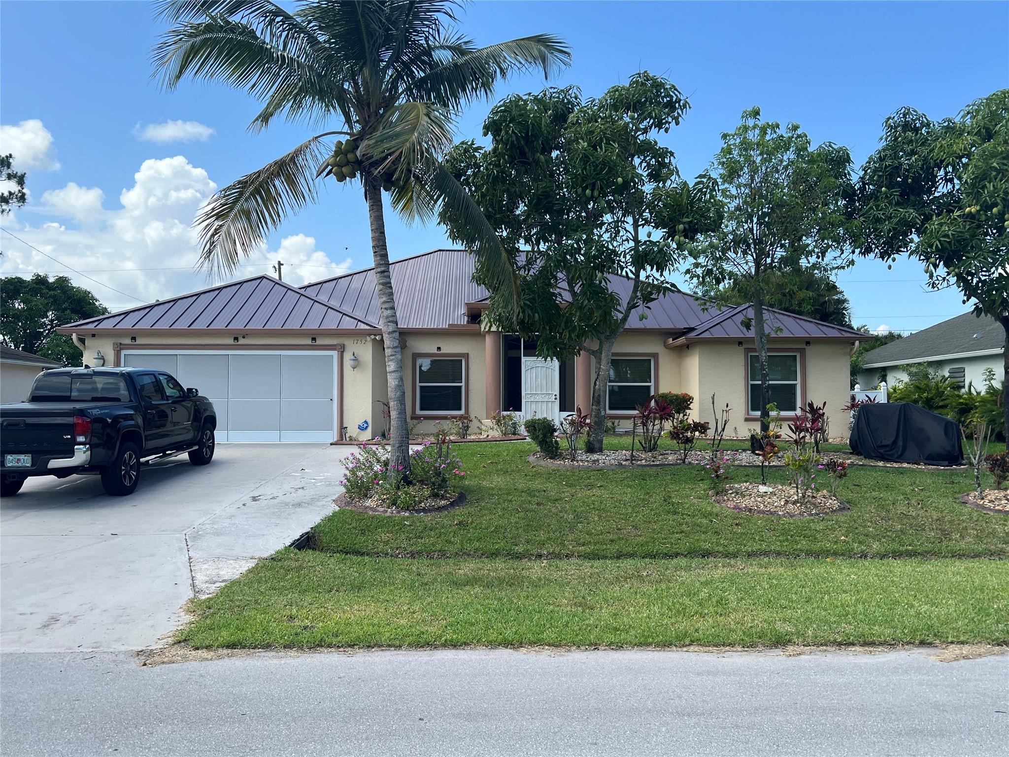 TIME TO BUY IS NOW! Why build when you can move right into this beautiful home. In the heart of SW Port St Lucie minutes to I95 & Tradition. A home that brings you joy, security, room for growth and large gathering spaces. CBS construction with impact windows and Metal Roof for peace-of-mind and homeowners insurance savings. A roomy Primary ensuite and 3 Guest rooms that may serve a large family or guest quarters. Search no more. Spacious single family home with Granite countertops, SS appliances, large kitchen, plenty of cabinet space. Oversize enclosed patio for family gathering, outdoor cooking Desire an oversized 2-car garage There's SO many value-added features and no HOA . Window Replacement 2024, New Metal Roof 2023, New AC and Water Heater installed June 2025