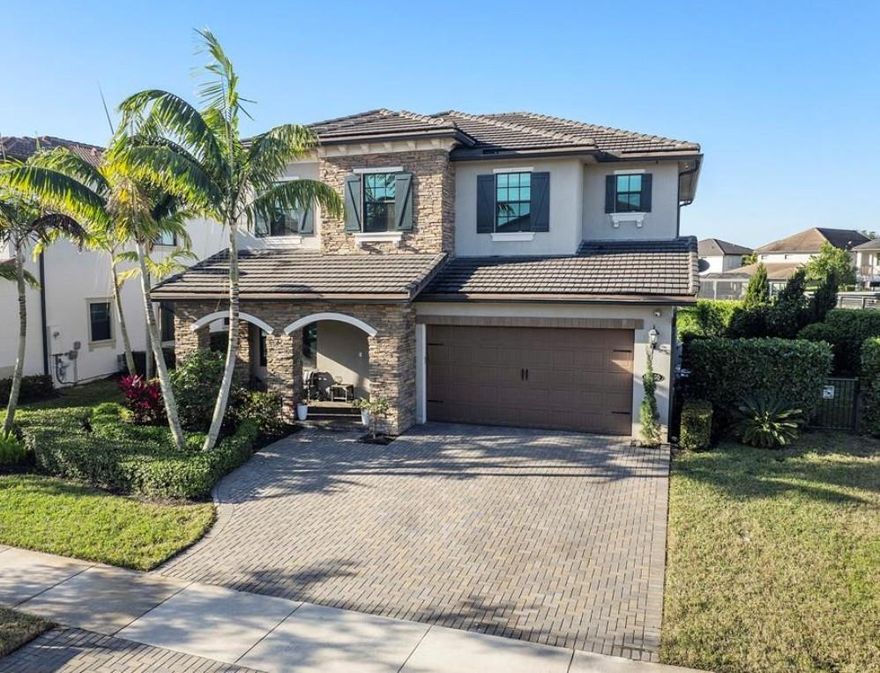 Spectacular 5 Bed & 4 Baths Home in Watercrest, ONLY 8 yrs old. Pretty long lake oversized lot & garden on one side. Heated salt water pool & spa with beach tanning shelf & umbrella anchor for shade & LED lighting. So many upgrades and details! Real wooden flooring & Italian Tile, Kitchen Aide stainless appliances, double ovens & Samsung smart refrigerator w/Alexa and WIFI stock hub. Quartz countertop island & breakfast bar, huge walk-in pantry designed by Closet Factory, Walnut kitchen cabinets with real stone backsplash & 2 matching accent stone TV walls w/ decorative remote fireplace. Open floor plan with tons of family space. Impact windows, doors & garage door. Custom designed Garage.  A Generator that fuels the entire home if you lose power. Central Vacuum System. Graded A+ Schools