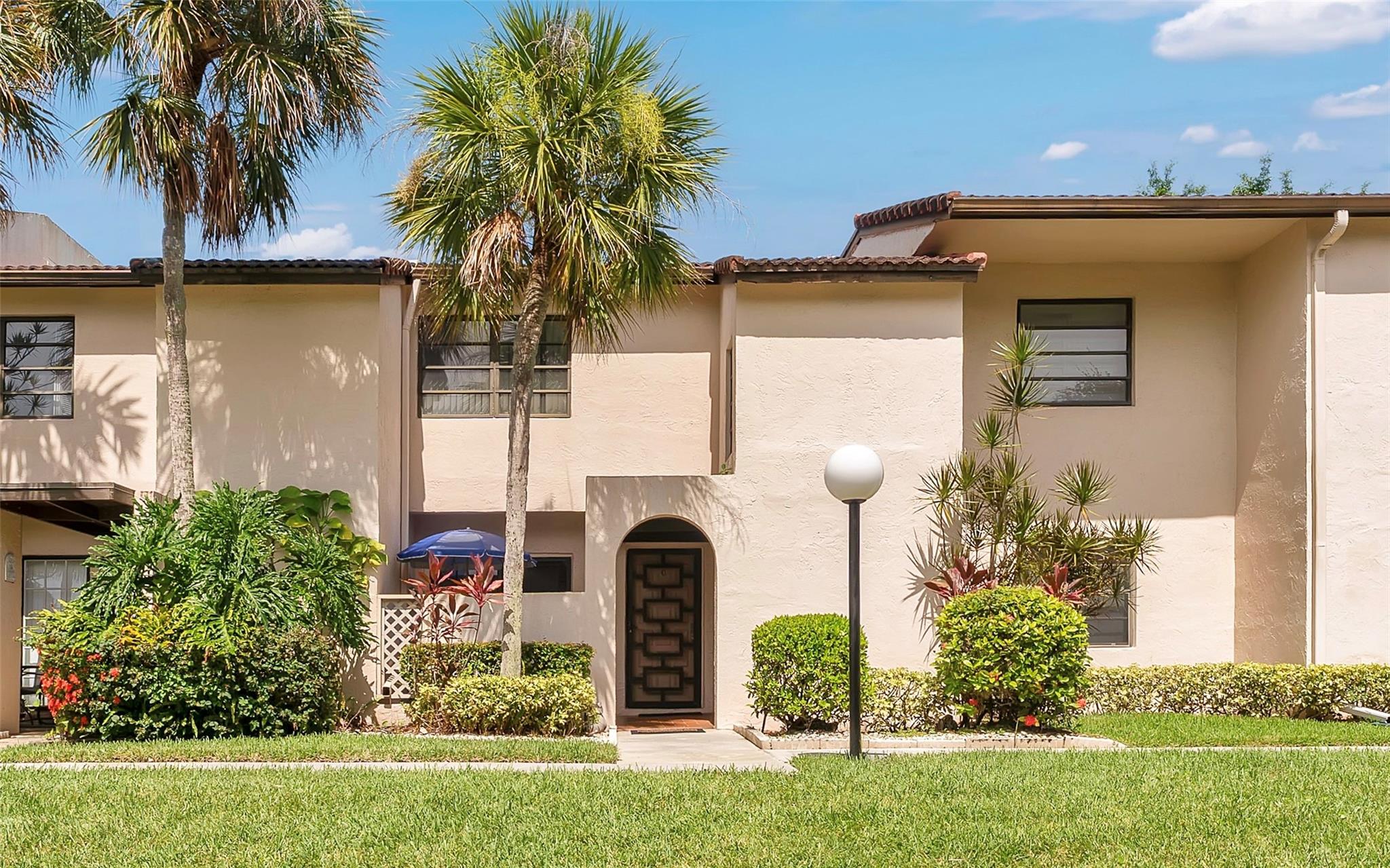 Beautiful 2 bed, 2.5 bath townhome located in the 55+ community of Boca Lago. Home features an open-concept kitchen with a large quartz center island, stainless steel appliances, Samsung refrigerator, & new LG washer & dryer. AC and water heater 2 years old. Enjoy smart home living with a security system. Spacious bedrooms offer walk-in closets, bathrooms upgraded with quartz countertops, porcelain wall tiles, LED mirrors, & a luxurious shower. New wood flooring throughout the first floor. Stunning lake views from the Florida room & the screened-in balcony off the primary bedroom. Just a short walk to the community pool & spa. Conveniently located near Uptown Boca, Town Center Mall, top restaurants, & entertainment. Also available for lease.
