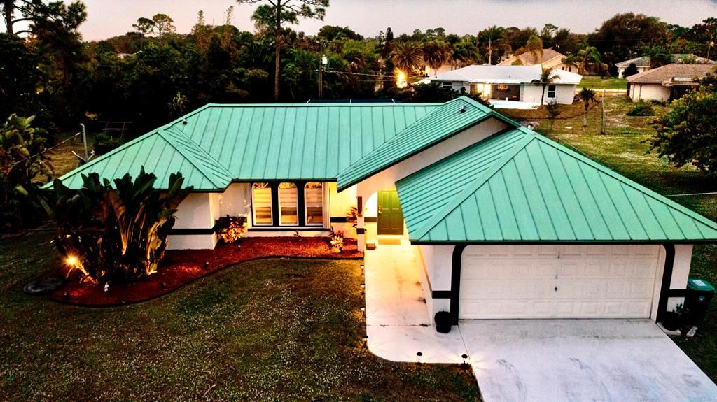 Photo of 631 SE Degan Drive, Port Saint Lucie, FL 34983 (MLS # R10760375)