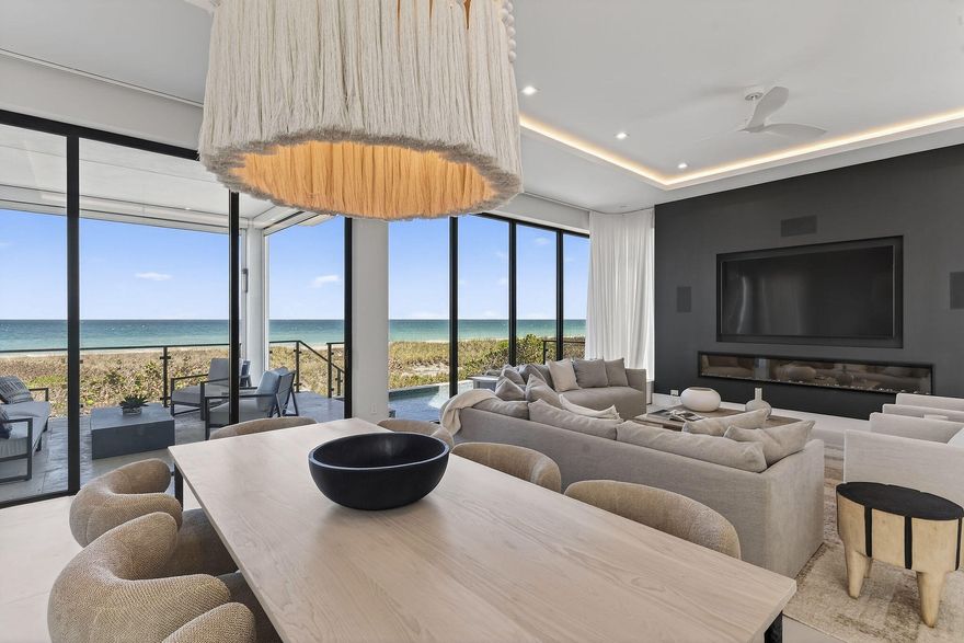 Experience elevated coastal living on Hutchinson Island in this stunning direct ocean residence in the exclusive Diamond Shores community. Built in 2025, this 3 story home boasts designer finishes that are only elevated by its breathtaking views. This elegant home is abundant with upgrades both from the developer and post-occupancy, and has been carefully outfitted with designer appointed decor in every room. Floor to ceiling glass on each floor capture endless and serene ocean vistas. Outfitted with a whole house elevator, 3 car garage, chef's kitchen with premium appliances, and a heated pool with Atlantic views, this move in ready home leaves little to be desired.