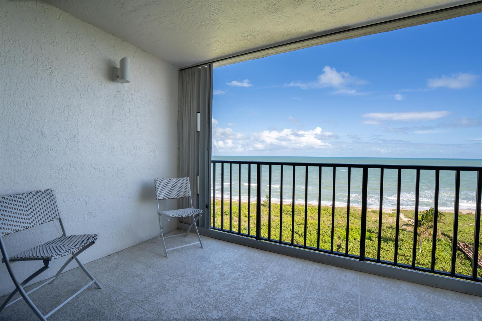 Experience breathtaking, unobstructed ocean views that stretch as far as the eye can see from this immaculate 10th-floor residence. Located in the heart of this charming coastal town, this beautifully appointed 3-bedroom unit offers the rare opportunity to live steps from the shore.Available for seasonal or annual lease, this fully furnished home provides the perfect blend of comfort and luxury. Many properties in the area are short-term rentals--but here, you can truly make paradise your home. Flexible rental terms with an option to purchase make this an exceptional opportunity you won't want to miss.