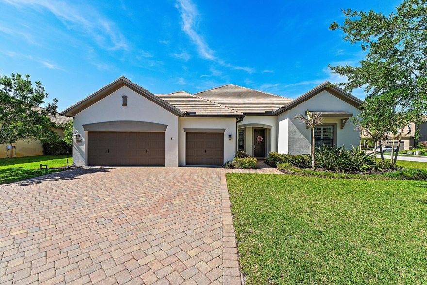 COPPERLEAF DREAM HOME! Stunning Dartmouth Model with the highly sought-after "B" elevation, custom exterior features, and flat tile roof. This beautifully upgraded 3BR / 3BA + Den / 3 Car Garage pool home sits on a premium corner lot with extended side yard., Highlights include wood floors throughout, plantation shutters, elevated ceilings, oversized 8' doors, crown molding, smooth walls, and a custom entertainment center with electric fireplace. Newly updated 2026 foyer with raised ceiling, board & batten, faux beams, and chandelier. The white gourmet kitchen features custom backsplash, under-cabinet lighting, stainless steel appliances, new oversized fridge (2025), and large walk-in pantry. Large sliding glass doors fully pocket into the wall for seamless indoor/outdoor living.  Enjoy your private backyard oasis with a custom saltwater pool with deck jet fountains, upgraded travertine decking, sunshelf, screened lanai, privacy hedges, and custom outdoor fire pit.  New 360 permanent trim lighting on front and back patio offers year-round security and customizable holiday lighting with separate controllers and timers—never hang Christmas lights again.  Additional upgrades include new 5-ton A/C (2025), Nest thermostat, custom master closet, laundry built-ins, garage storage, exterior paint (2023), and abundant storage throughout.  Luxury, function, and move-in ready living in one of Copperleaf's most desirable homes!