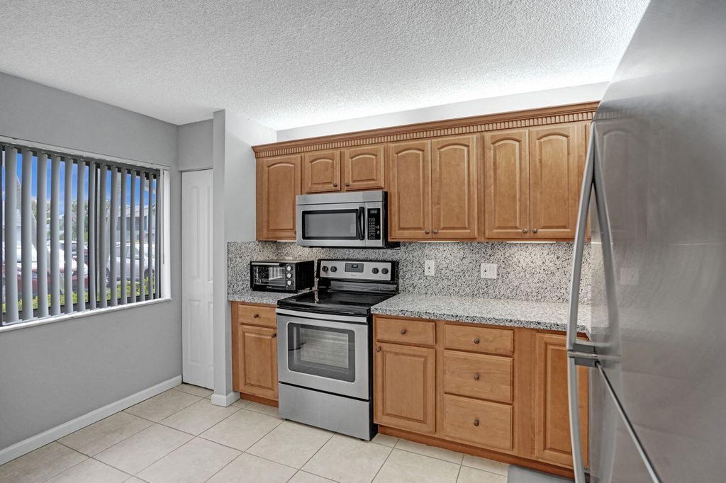 Photo of 2641 Gately Drive W #1002, West Palm Beach, FL 33415 (MLS # R10940143)