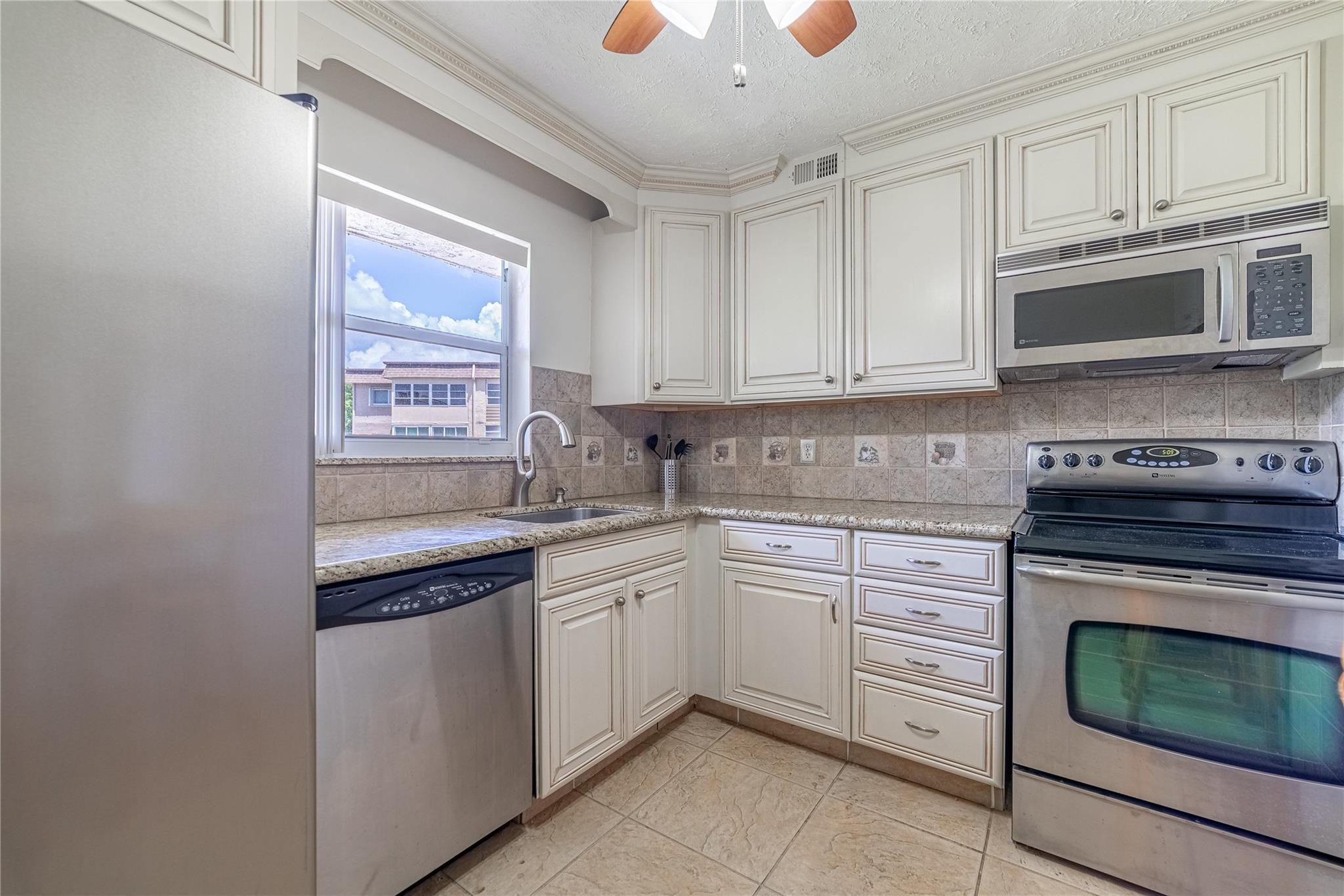 Turnkey comfort in popular Lakeside Village! This furnished, converted 2-bed/1.5-bath 55+ condo is on the 2nd floor of Bldg 15 with elevator and laundry on the same floor, steps to the clubhouse & two heated pools. Bright ceramic-tile interior offers an enclosed 2nd bedroom, and a 3-yr-new A/C for year-round ease. Cook in the fully equipped kitchen, then sip coffee on your enclosed patio. Huge walk-in closet + assigned parking. Rent includes water, cable & internet. Active 55+ community with shuffleboard, bocce, putting green & more—just bring your suitcase!