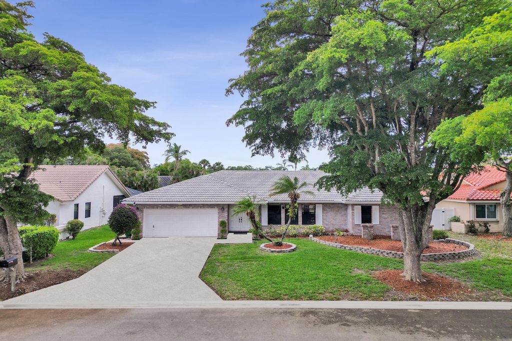 Photo of 5147 NW 59th Way, Coral Springs, FL 33067 (MLS # B26034834)