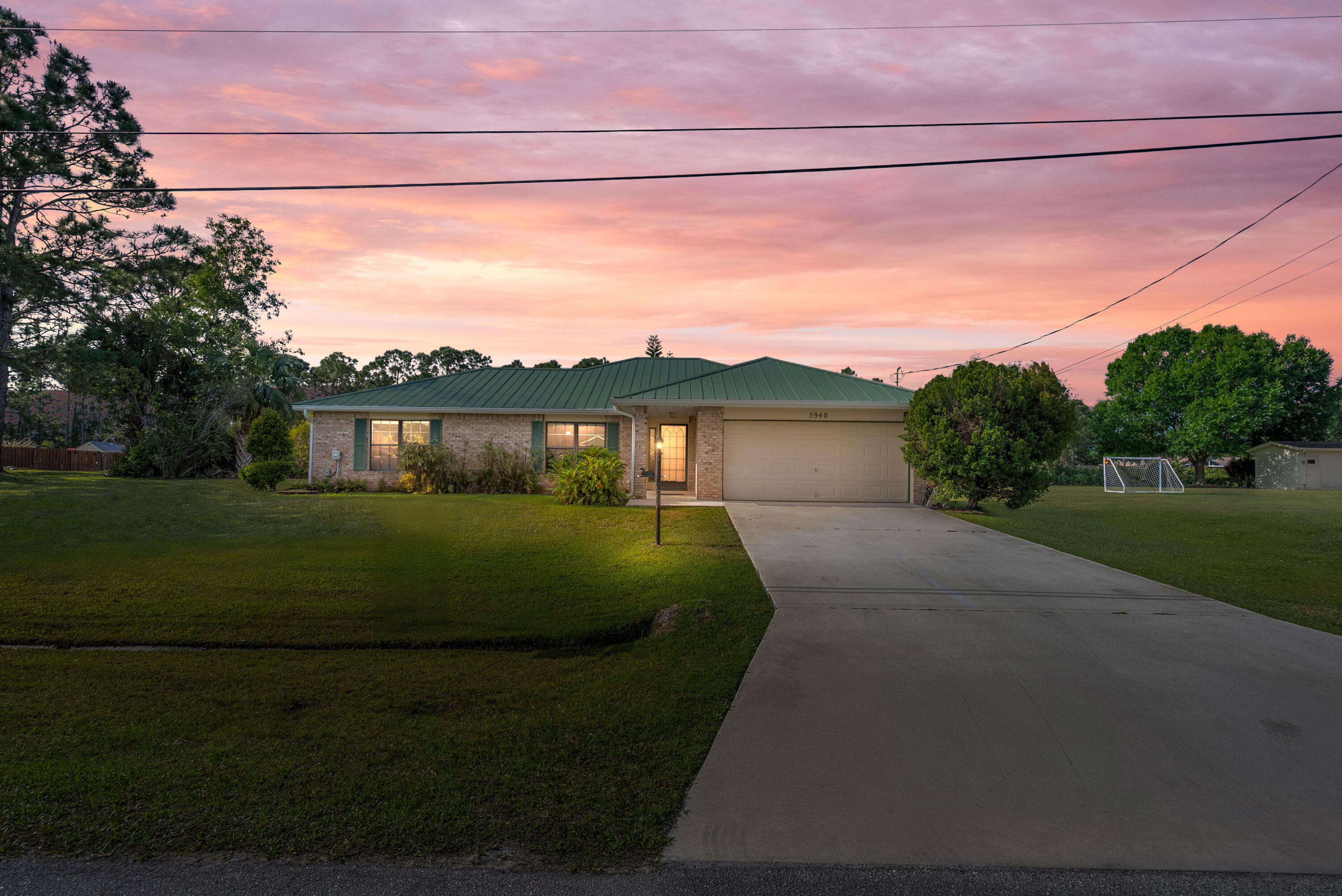 Welcome to 5940 Brenda Circle! This lovely 3-bedroom, 2-bath CBS home features a durable metal roof, a spacious family room, and a larger backyard--perfect for relaxing or entertaining. Located just minutes from the stadium, this home offers easy access to major highways, shopping, and dining. Bonus opportunity: The adjacent lot next door is also available in tandem for $610,000 total! Don't miss out on this fantastic opportunity--schedule your showing today!