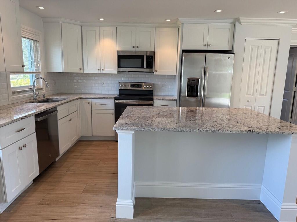 Photo of 1611 Treemont Avenue, Jupiter, FL 33469 (MLS # R11147453)