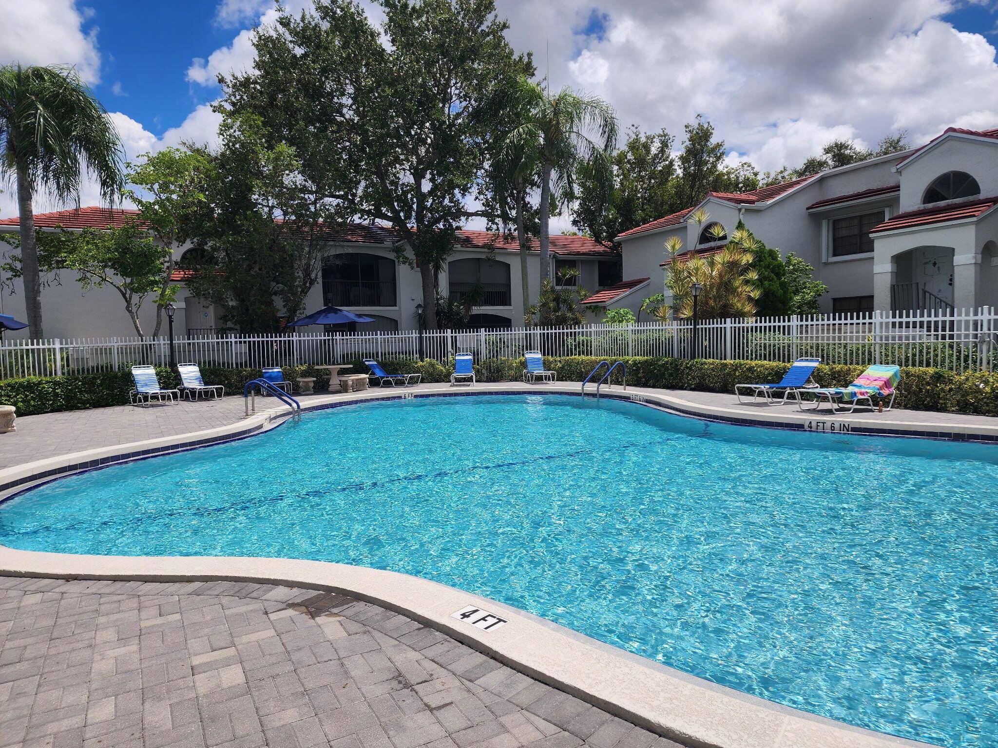 Welcome home to this charming 2-bedroom, 2-bathroom condo located in the desirable gated community of PierPointe in the heart of Pembroke Pines. Easy access to community pool.  All secured by a 24hr manned security gate development. One assigned parking space with plenty of guest parking.   Step inside to a spacious living area that flows seamlessly to a screened-in patio--perfect for relaxing or entertaining. The master suite offers generous space and comfort.  Ideally situated just moments from Memorial Hospital West, Pembroke Lakes Mall, top-rated schools, parks, dining, and shopping, with easy access to all major highways, this residence combines convenience with the warmth of community living. A MUST SEE!