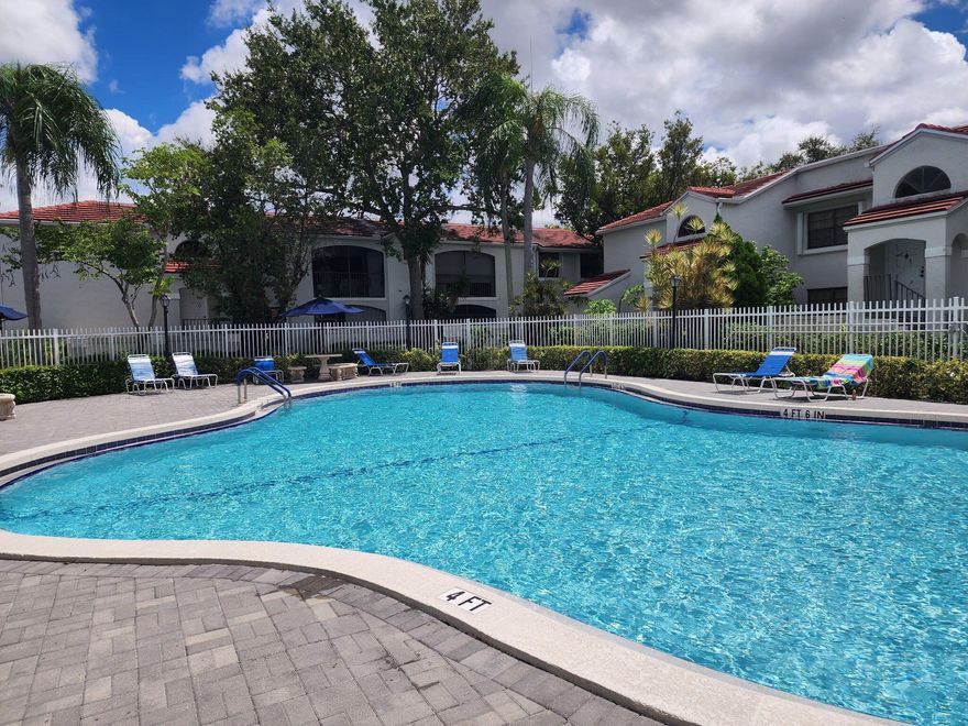 Welcome home to this charming 2-bedroom, 2-bathroom condo located in the desirable gated community of PierPointe in the heart of Pembroke Pines. Easy access to community pool.  All secured by a 24hr manned security gate development. One assigned parking space with plenty of guest parking.   Step inside to a spacious living area that flows seamlessly to a screened-in patio--perfect for relaxing or entertaining. The master suite offers generous space and comfort.  Ideally situated just moments from Memorial Hospital West, Pembroke Lakes Mall, top-rated schools, parks, dining, and shopping, with easy access to all major highways, this residence combines convenience with the warmth of community living. A MUST SEE!