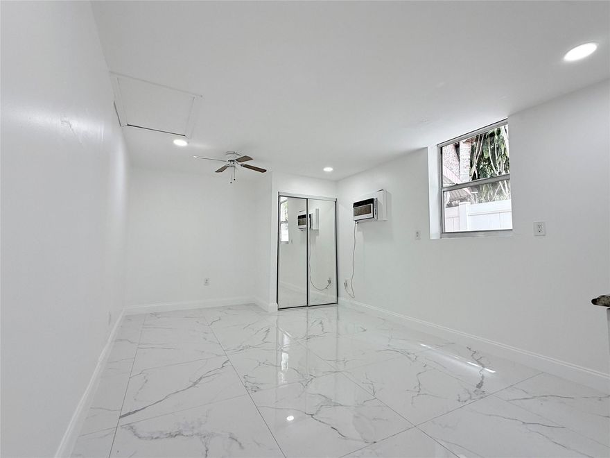 Newly Renovated Studio Apartment in the Heart of Hollywood, FL!
This sleek and modern studio apartment offers the perfect blend of comfort and convenience. Featuring stunning porcelain marble-look tile floors throughout, the space is bright, airy, and move-in ready. The open-concept layout includes a small kitchen with nice white cabinetry, perfect for easy meal prep.
Modern bathroom with a walk-in shower, modern fixtures, and matching marble-style tile. Additional highlights include a wall-mounted A/C unit, ceiling fan, recessed lighting, and plenty of natural light through updated windows.

Located in a quiet residential area, this studio is just minutes from downtown Hollywood, beaches, and major highways. 
$500 Security Move-in! Water and electric included in rent.