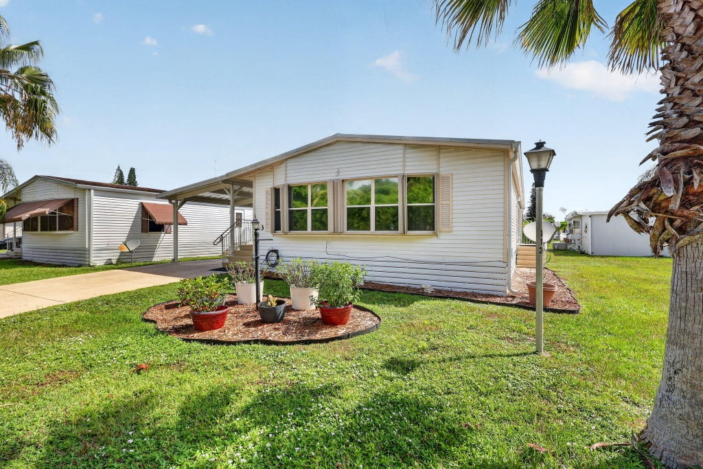 Photo of 23 Mediterranean Boulevard W, Port Saint Lucie, FL 34952 (MLS # B26069337)