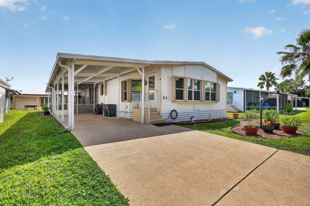 Photo of 23 Mediterranean Boulevard W, Port Saint Lucie, FL 34952 (MLS # B26069337)