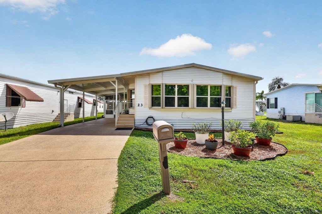 Photo of 23 Mediterranean Boulevard W, Port Saint Lucie, FL 34952 (MLS # B26069337)