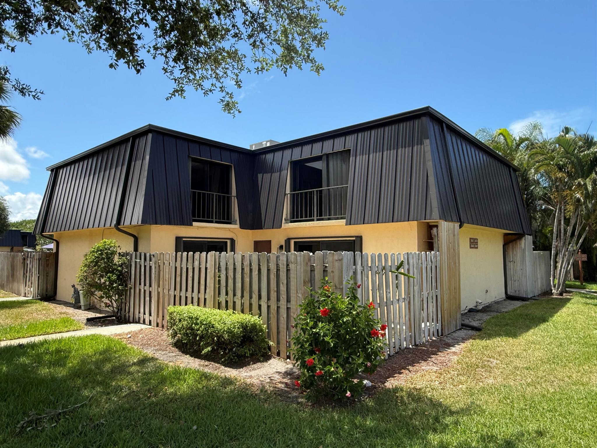 Welcome to Waterside Estates! This spacious 2bed/2.5baths townhouse is located in a gated community just minutes from I-95, the beach, and vibrant downtown. Enjoy peace of mind with a durable new metal roof and impact windows. The home features tile flooring throughout--no carpet! A fully fenced private courtyard offers the perfect space for outdoor relaxation. Spacious storage closet in the patio area. Waterside offers residents access to a community pool and is known for its prime location and charming atmosphere. Don't miss this well-maintained home in a prime location!!