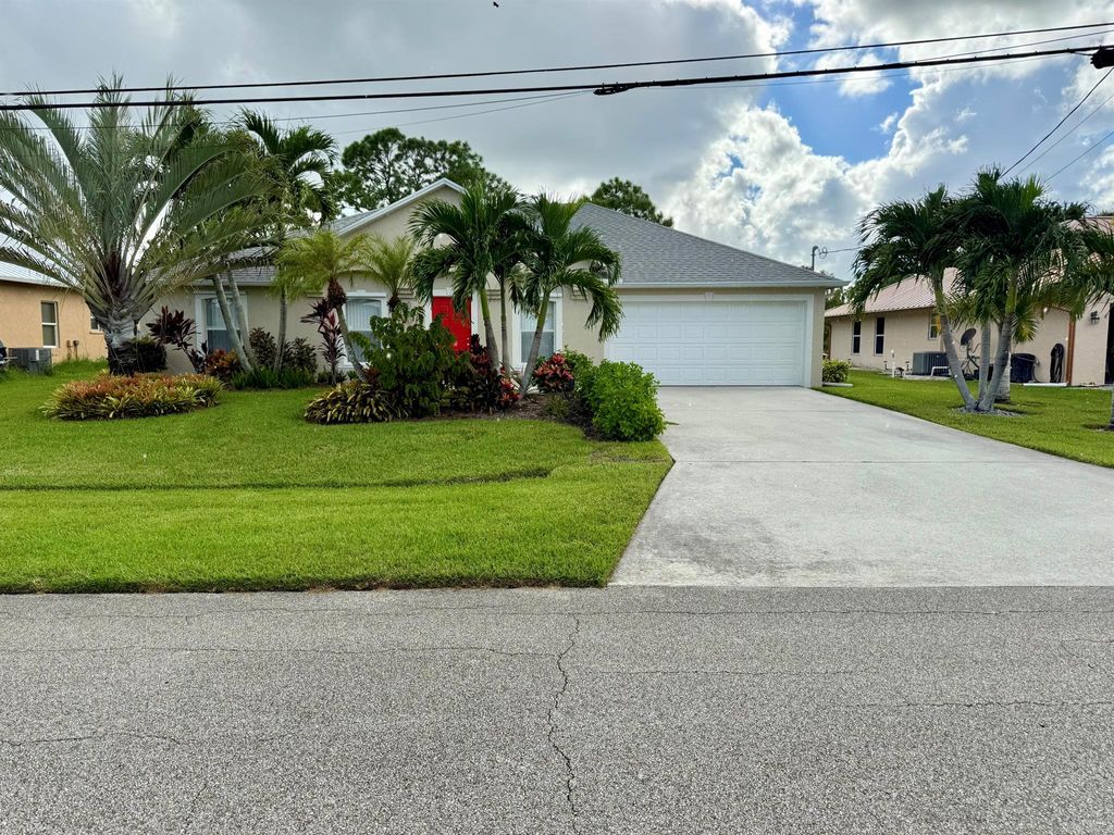 Photo of 5890 NW Dowse Street, Port Saint Lucie, FL 34986 (MLS # R11125604)