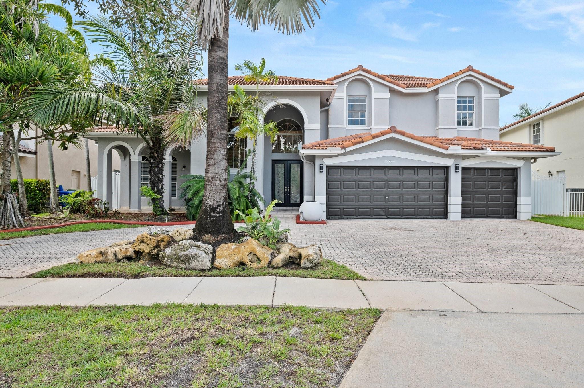 Spectacular home in the highly desirable community of Spring Valley Estates. Featuring 5 bedrooms 3 1/2 Baths and an amazing super sized lot RARE to find right in the heart of Pembroke Pines. As you enter this gem you are met with spectacular high ceilings, staircase and gorgeous porcelain floors. Formal Living Room, spacious Kitchen with a TV Area. Formal Dining Room. One Bedroom is located on the first floor. Remodeled Bathroom, Guest Bathroom and a Laundry. Second floor boasts the Master Suite, incredible size with two walk-in closets. Master Bathroom completely remodeled with a freestanding tub and pebbled shower. Three additional Bedrooms with a bathroom. Resort style backyard, gated with preserve view for privacy, tiki-hut and shed perfect for entertaining. Don't miss it. Call today.