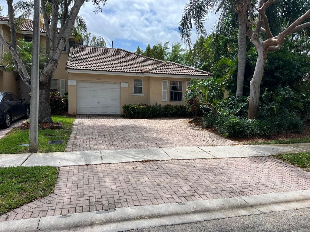 Photo of 8936 NW 53rd Court, Sunrise, FL 33351 (MLS # B26014194)