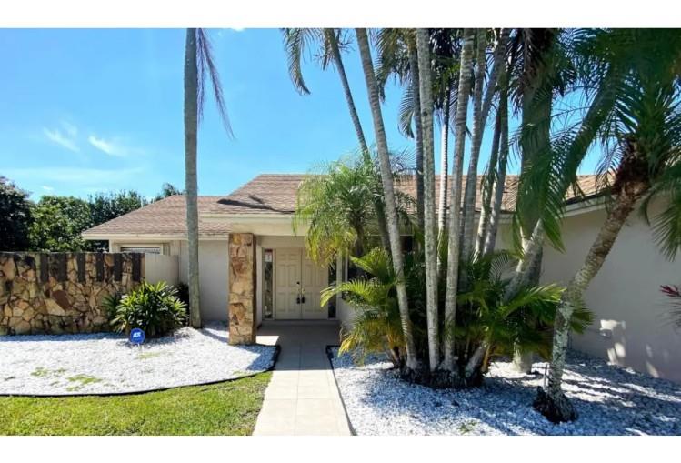 This is the one you’ve been waiting for! 9811 Majorca Place delivers the ultimate Boca lifestyle with a brand new 2025 roof, a massive fenced-in backyard (over 10,000 sq ft!), and a sparkling screened-in pool surrounded by tropical privacy. Step inside and you’ll find light-filled living spaces with crown molding and tile floors throughout, stylishly updated bathrooms with dual vanities and glass vessel sinks, plus the convenience of a two-car garage and dedicated laundry room.
Relax on the expansive covered patio with ceiling fans, host unforgettable gatherings by the pool, or let the kids and pets run free in one of the largest backyards in the neighborhood. With plenty of room for entertaining, gardening, or even future expansion, this home offers rare flexibility and value.