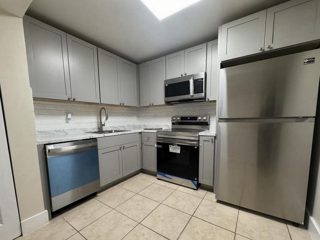 Photo of 711 N Pine Island Road N #103, Plantation, FL 33324 (MLS # B26024631)