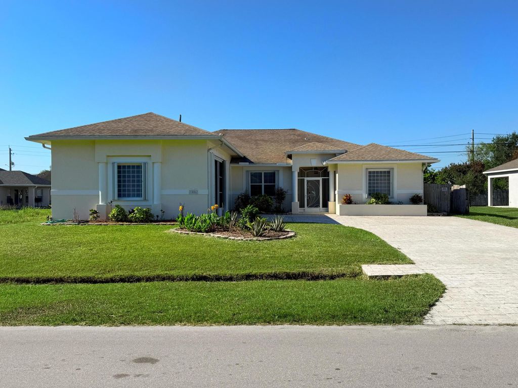 Photo of 1006 SW Majorca Avenue, Port Saint Lucie, FL 34953 (MLS # B26023796)