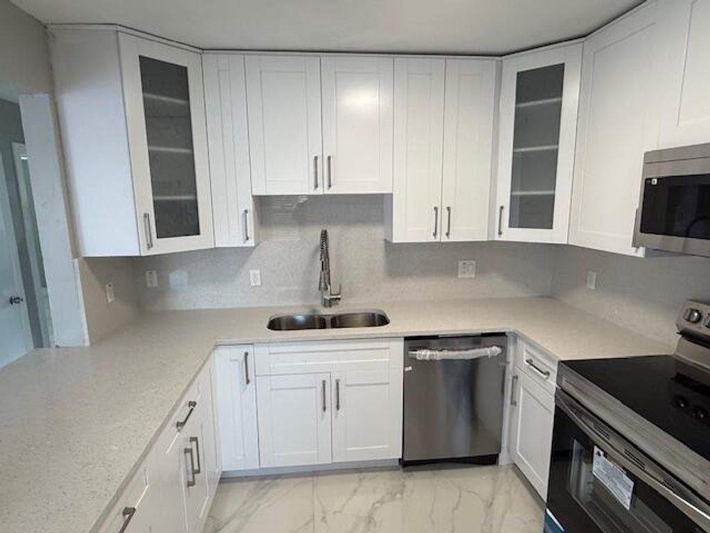 Photo of 810 Lake Shore Drive #19, Lake Park, FL 33403 (MLS # R11155688)