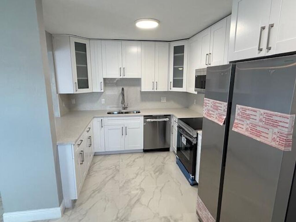 Photo of 810 Lake Shore Drive #19, Lake Park, FL 33403 (MLS # R11155688)