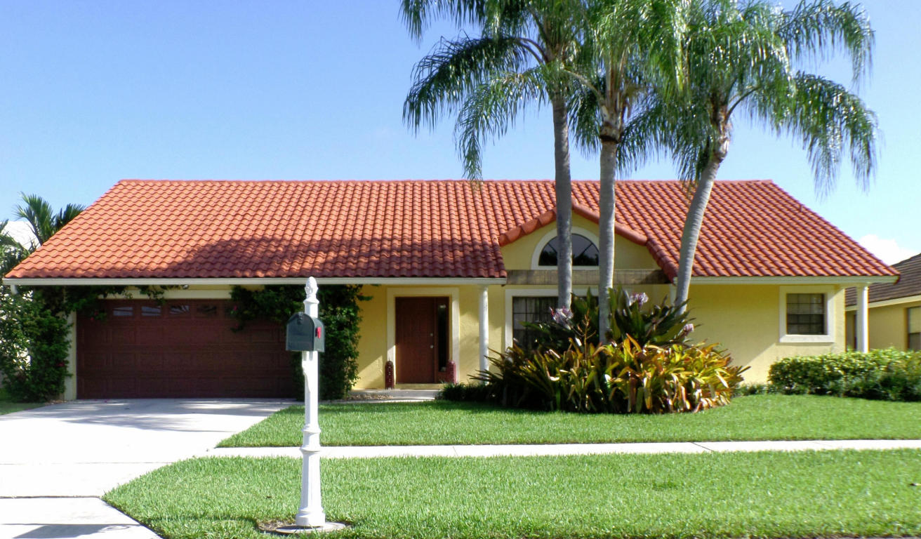 Beautifully maintained one story, 4 bedrooms, 2 baths, 2-car garage home with new modern kitchen cabinets, sleek quartz counter tops, tiled backsplash, snack bar and stainless steel appliances. Spacious master suite with view of the pool and lake. This home boasts a formal dining room, formal living room and open floor plan. Bedrooms have newer laminate flooring. The interior and exterior home was painted in 2014 and freshly power-washed. New A/C in 2010 and water heater in 2011. Most light fixtures have been upgraded as well. Serene views of the lake and pool abound. Community has tennis courts, basketball courts, fitness center and a playground. Very reasonable HOA. Nothing to do, but move in. This home is the pride of ownership!