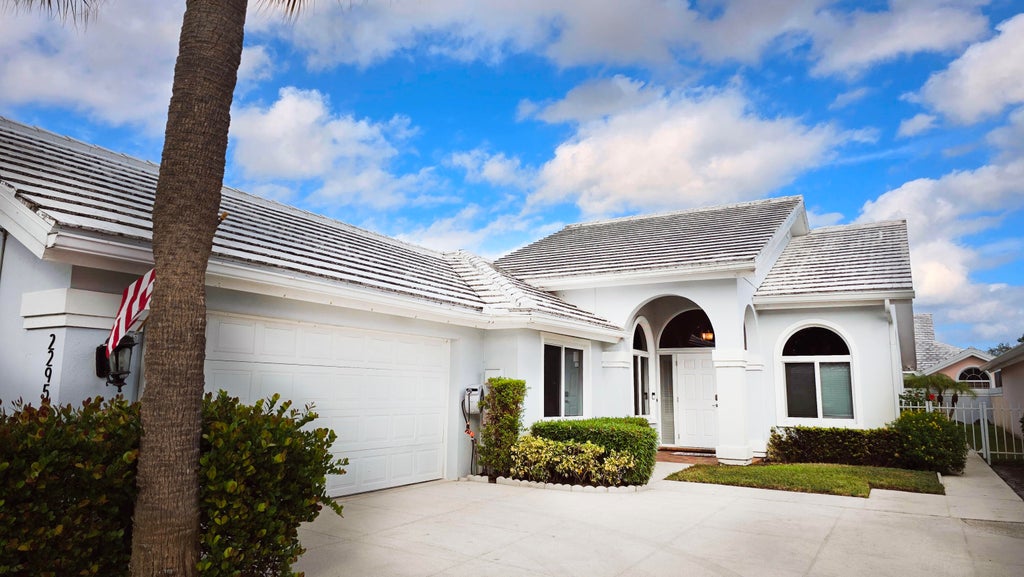 Photo of 2295 Saratoga Lane, West Palm Beach, FL 33409 (MLS # B26071433)