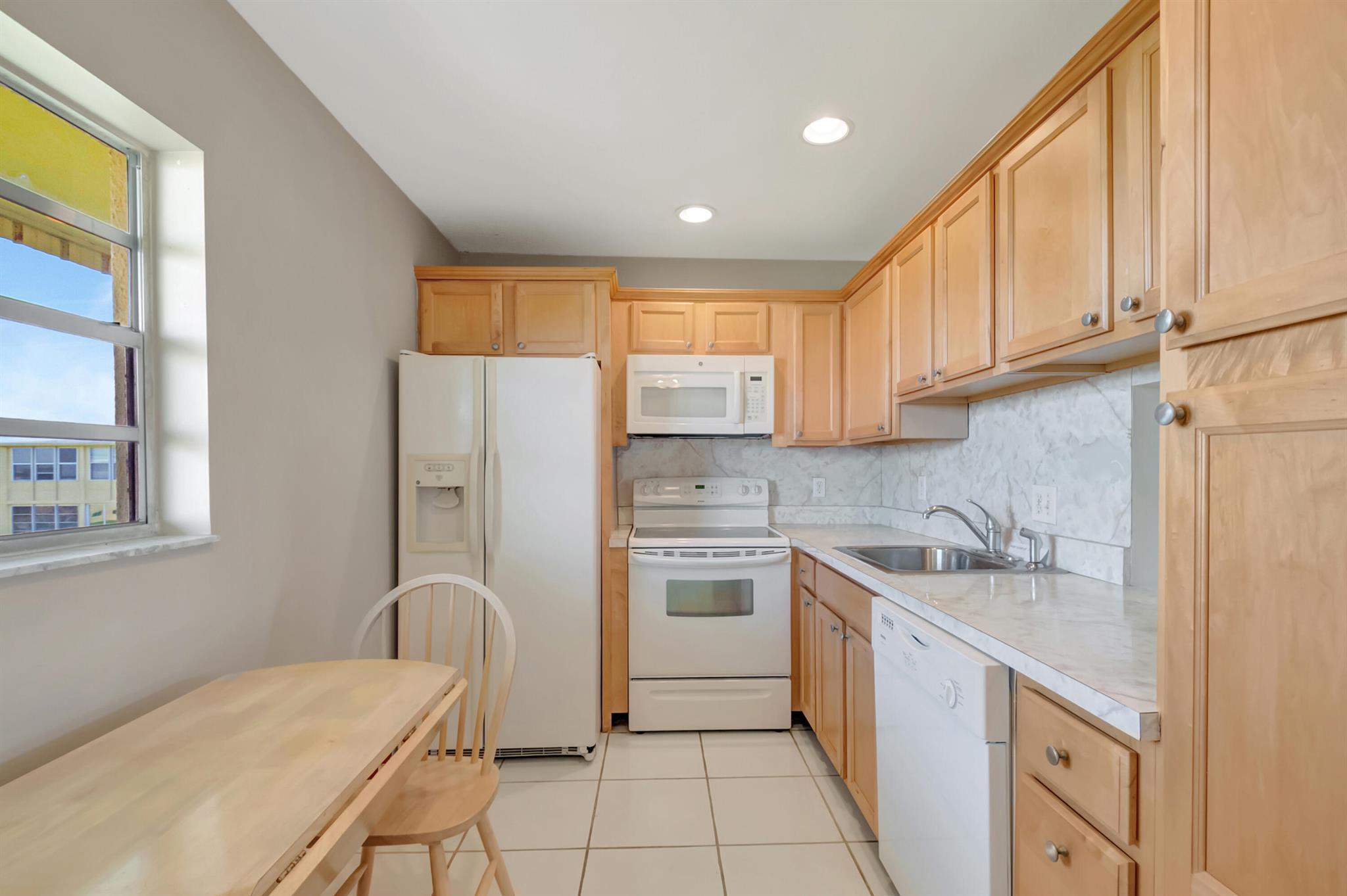 Enjoy ''Easy Living'' in this charming 1 bedroom, 1.5 bathroom condo nestled within a vibrant 55+ active community. Designed for comfort and convenience, this unit features a spacious living area, well-appointed kitchen and private master suite with an en-suite bathroom. An additional half-bath ensures ease for both residents and guests. Convenient to main clubhouse, community activities and beautiful garden walk area. Amenities include main clubhouse with large heated pool, theatre, card rooms, business center. Satellite pool across from condo building. Second clubhouse has a gym. Tennis, bocce courts, pickleball and shuffleboard is available. There is a 2 year waiting period to rent. Convenient to shopping, dining and short drive to beaches. Building has video surveillance.