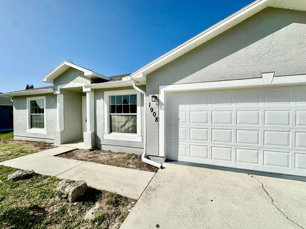 Photo of 1908 SE Mantua Street, Port Saint Lucie, FL 34952 (MLS # R10957960)