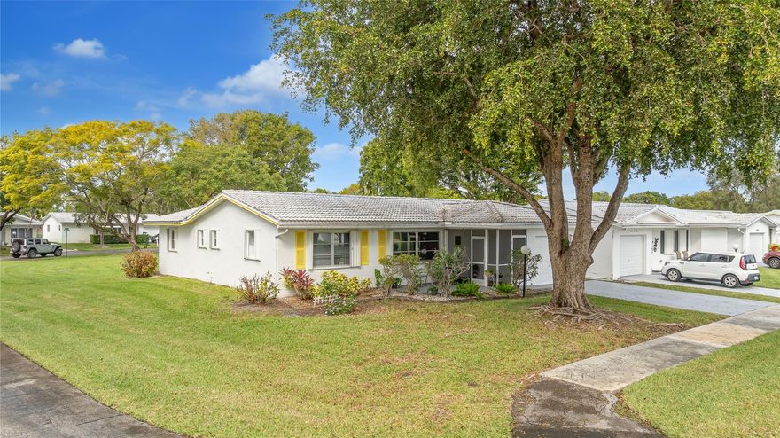 Welcome to Lauderdale West! This move in ready home sits on a private corner lot w/ no direct rear or side neighbor offering added privacy & space. The home features 2 bedrooms plus an air-conditioned Florida room, ideal as a third bedroom or home office. Highlights include a spacious family room, formal dining, a large eat-in kitchen w/ wood cabinetry, granite countertops, stainless steel appliances (newer refrigerator), crown molding, wood-look porcelain tile flooring, brand-new washing machine, smooth ceilings (no popcorn) & accordion hurricane shutters. The reasonable association fee covers lawn care, exterior pest control, house painting, basic cable / internet, roof repair / replacement and access to community amenities including clubhouse, gym, tennis, pool, shows & activities.