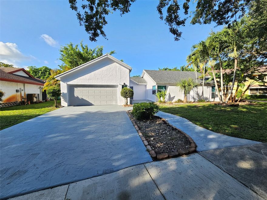Perfect Cooper City House to call Home! This home is a 3 bedroom 2 bathroom featuring a large Family room area that has vaulted ceilings, with tons of natural light coming through multiple sets of sliders that look out over an enormous screened in patio. This property sits on a 10,000 square foot lot, tons of room for a pool! Roof installed in 2020, Central Ac in 2023, impact windows and doors and impact garage door.  Kitchen has quartz counters and Stainless Steel appliances. Perfect Cooper City House to call Home! This home is a 3 bedroom 2 bathroom featuring a large Family room area that has vaulted ceilings, with tons of natural light coming through multiple sets of sliders that look out over an enormous screened in patio. This property sits on a 10,000 square foot lot, tons of room for a pool! Roof installed in 2020, Central Ac in 2023, impact windows and doors and impact garage door.  Kitchen has quartz counters and Stainless Steel appliances.