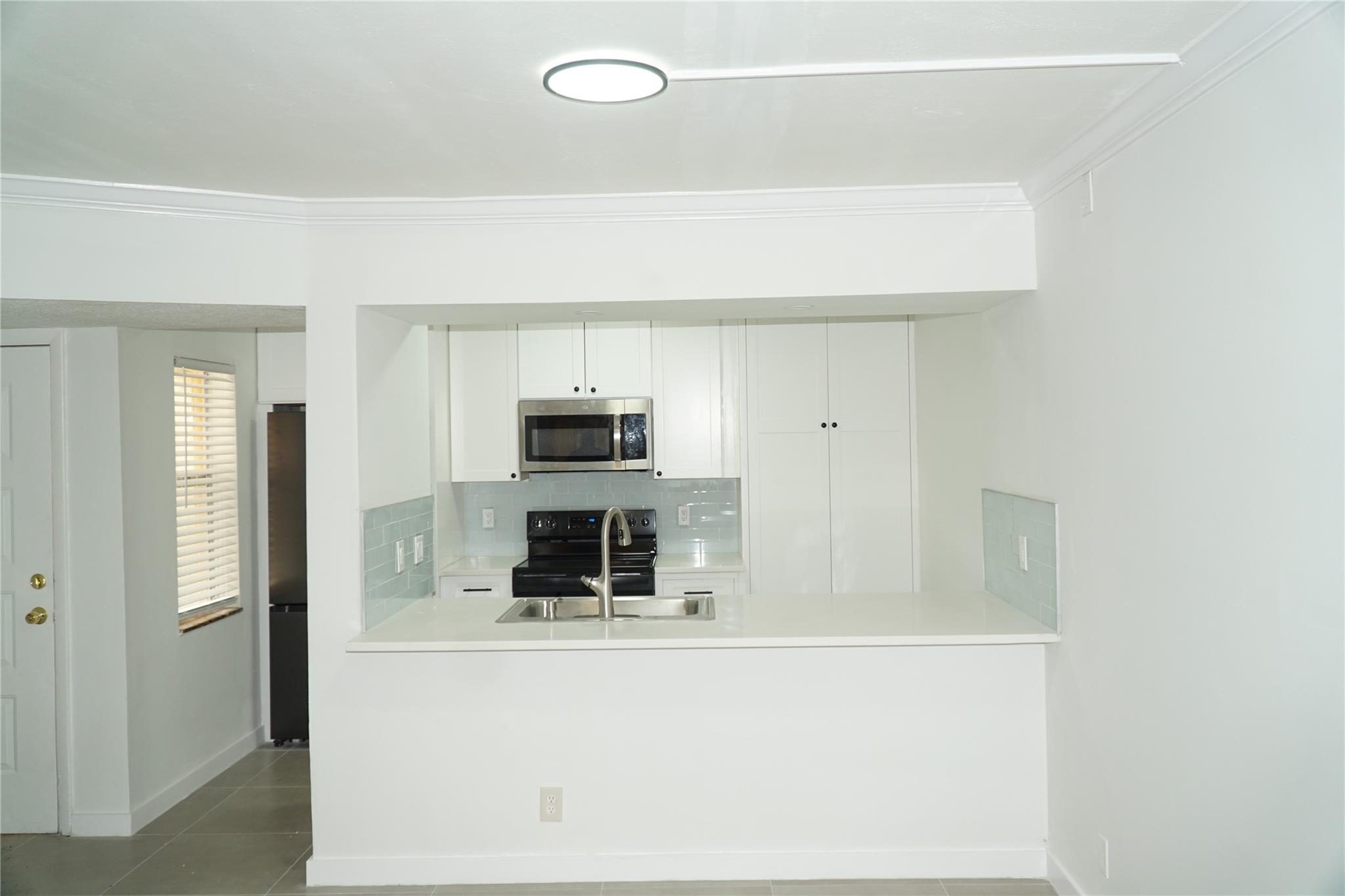 Presenting this fully renovated 3 bed 2 bath condo featuring the convenience of an in-unit washer and dryer. Enjoy peace of mind with all-new finishes throughout, including a brand-new A/C system. Start your day with a morning coffee or unwind in the evening while taking in the tranquility of your private outdoor space. This one will not last see broker remarks for additional details.