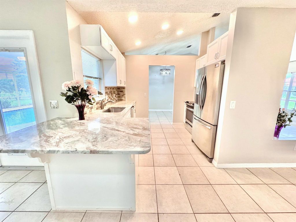 Photo of 2349 SE Leithgow Street, Port Saint Lucie, FL 34952 (MLS # R11023192)