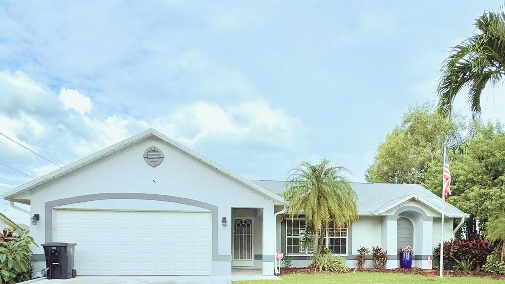 Photo of 2349 SE Leithgow Street, Port Saint Lucie, FL 34952 (MLS # R11023192)