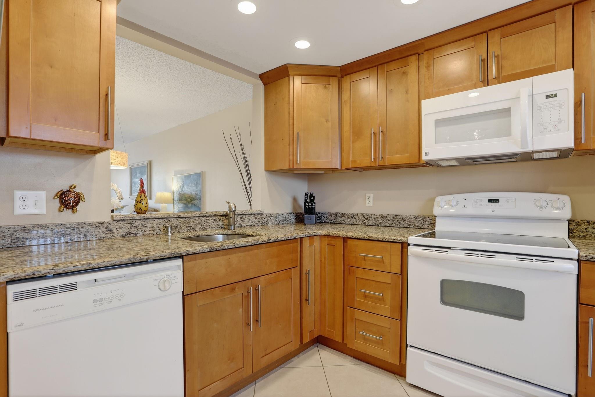 WELCOME HOME! Spacious 2 bedroom, 2 bath, tastefully updated and SOLD TURNKEY – furnishings and accessories included. Prime location in a sought-after community, just steps to pool, BBQ area and clubhouse. Kitchen features honey maple cabinetry, smooth ceilings and recessed lighting. Desirable Building N offers water and tree-lined views from primary bedroom and living areas. Enjoy the canal view from your screened lanai. Easy-care tile flooring with laminate in bedrooms. Required inspections complete!! Assessment paid in full by seller, Lease 1st year allowed. One assigned parking plus plenty of guest spots. Guard-gated with 2 pools, fitness, clubhouse, rec room and more – only 2 miles to the beach. Call today for your private showing!