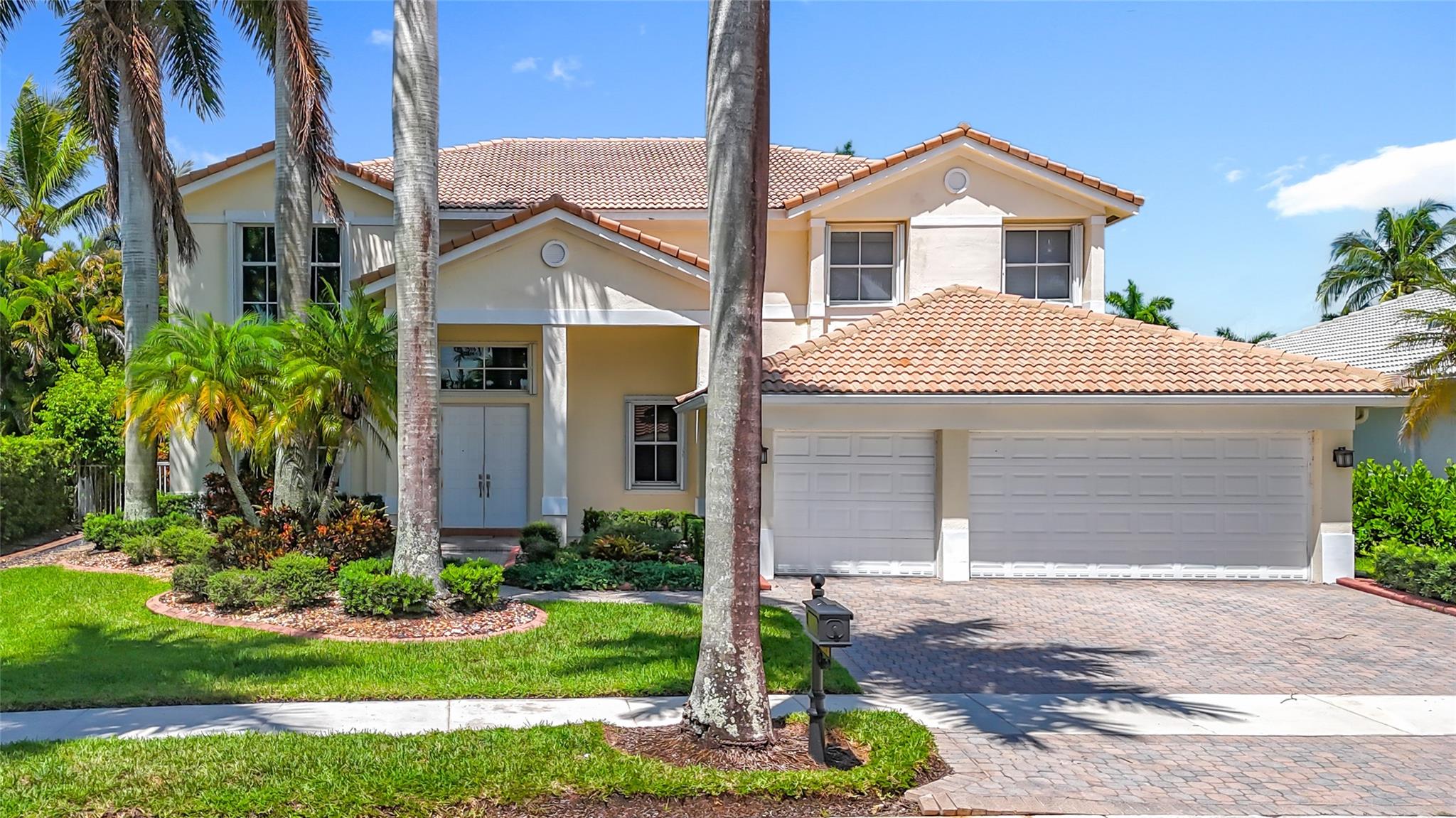 Gorgeous and bright home in the prestigious Weston Hills Country Club. This well-maintained residence offers 4 bedrooms, 4 full bathrooms, a loft upstairs, and a versatile den/office/bonus room ideal for a home office, media room, or guest suite plus a 3-car garage. Accordion hurricane shutters included. The grand entrance features soaring ceilings, top-of-the-line appliances, marble floors downstairs, and dark-wood laminate upstairs. Elegant recessed lighting adds warmth, while custom stone accent walls in the family and dining rooms create a designer touch. Step outside to your private backyard oasis with a custom-designed pool and beautifully landscaped grounds, perfect for outdoor living and entertaining.