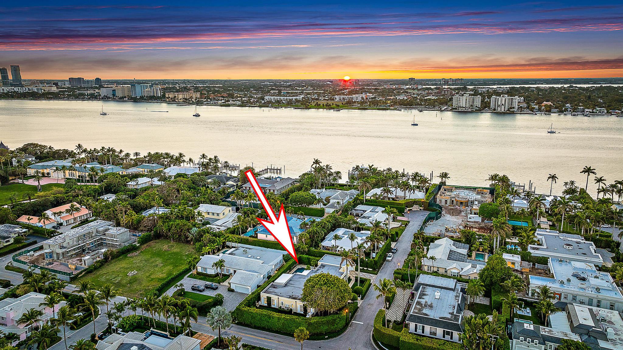 This beautifully updated four-bedroom, four-bathroom home offers modern comfort in a peaceful and highly desirable Palm Beach location. Under went a major renovation in 2019, updates include a new roof, impact windows and doors, updated electrical, air conditioning, and a refreshed pool with new tilework. Thoughtfully designed, this home blends stylish upgrades with a tranquil setting, offering a perfect balance of privacy and convenience.Situated on a beautifully maintained, quiet street, this property provides a rare opportunity to enjoy a private retreat while remaining close to everything Palm Beach has to offer. The spacious backyard is surrounded by lush landscaping and features a large private pool, creating an ideal space for relaxation or entertaining.