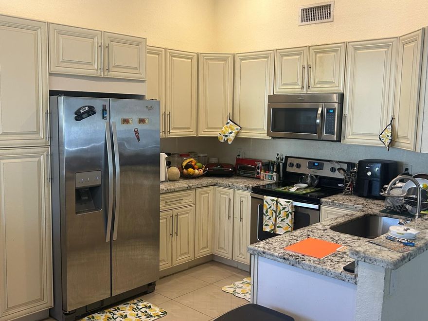 LOCATED IN A WELCOME FAMILY -FRIENDLY COMMUNITY. THIS 3 BEDROOMS AND 2 BATHROOMS SINGLE FAMILY HOME OFFERS CONFORT AND CONVENIENCE, INCLUDING A PRIVATE EN-SUITE BATHROOM IN THE PRIMARY BEDROOM. FREE GUEST PARKING IS LOCATED DIRECTLY ACROSS THE STREET FOR ADDED EASE. RESIDENTS AND GUESTS ENJOY ACCESS TO A COMMUNITY POOL AND TENNIS COURTS, ALONG WITH A NEARBY PARK FEATURING A DEDICATED PLAY AREA PERFECT FOR OUTDOOR FUN, RELAXATION AND CREATING LASTING MEMORIES CLOSE TO HOME. THE REMODELED KITCHEN FEATURES SOFT-CLOSE CABINETRY, STAINLESS STEEL APPLIANCES AND SALTED GRANITE COUNTERTOPS, PORCELAIN TILE FLOORING RUNS THROUGHOUT, IMPACT WINDOWS. A/C AND WATER HEATER 2015 AND ROOF 2019. REQUEST A SHOWING TODAY.